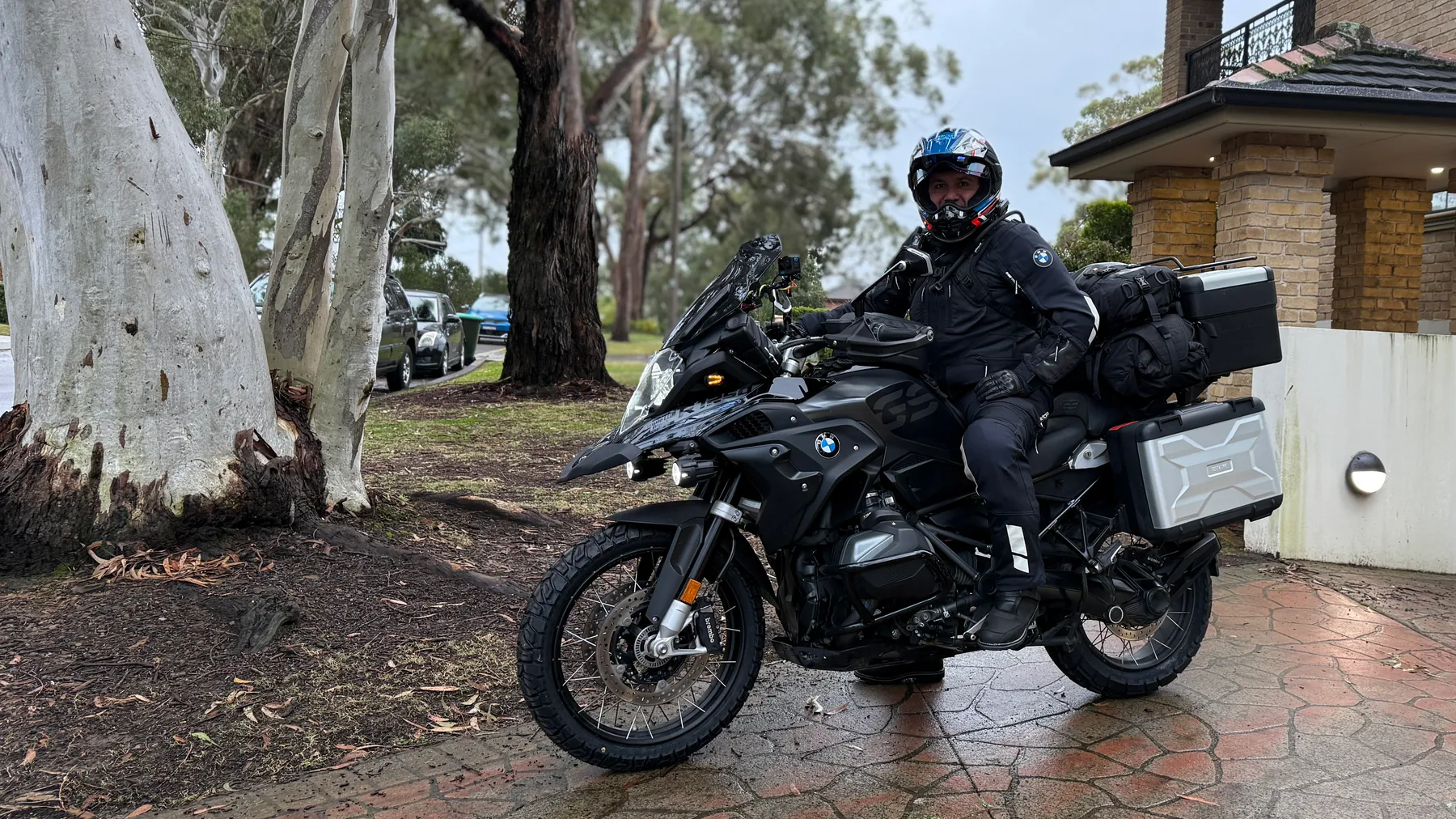 Founder beside a loaded BMW R1250GS before the ride